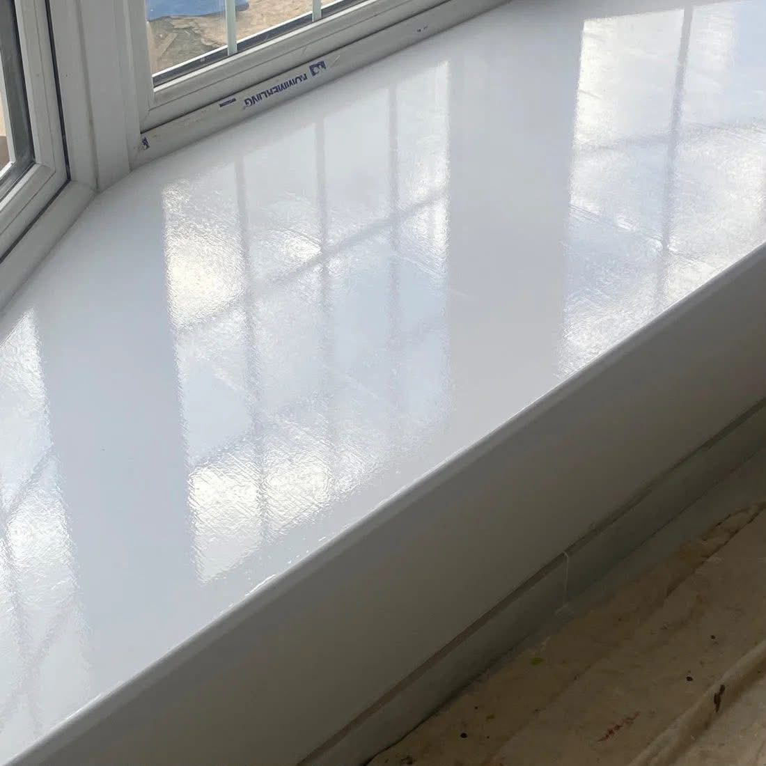 Close-up of a white gloss window sill