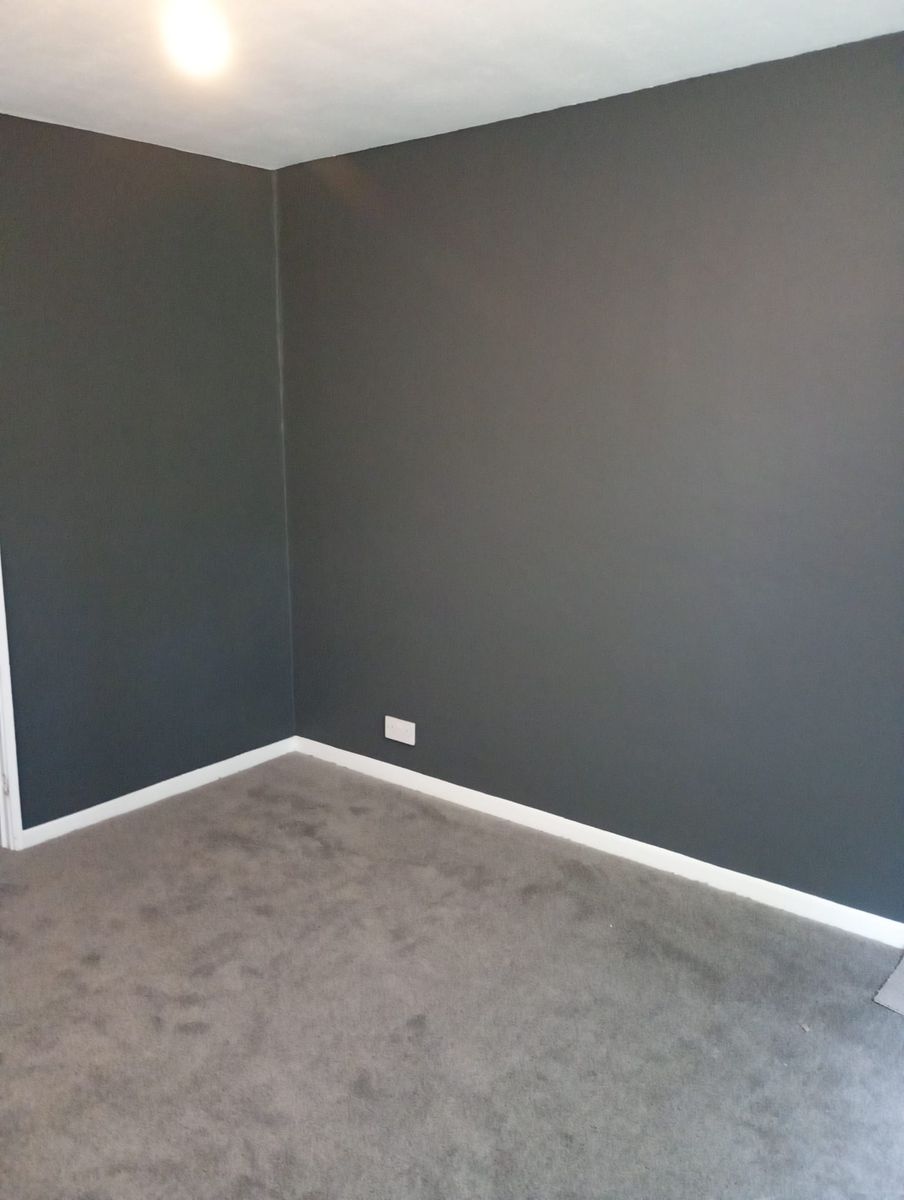 Room with grey walls and white skirting